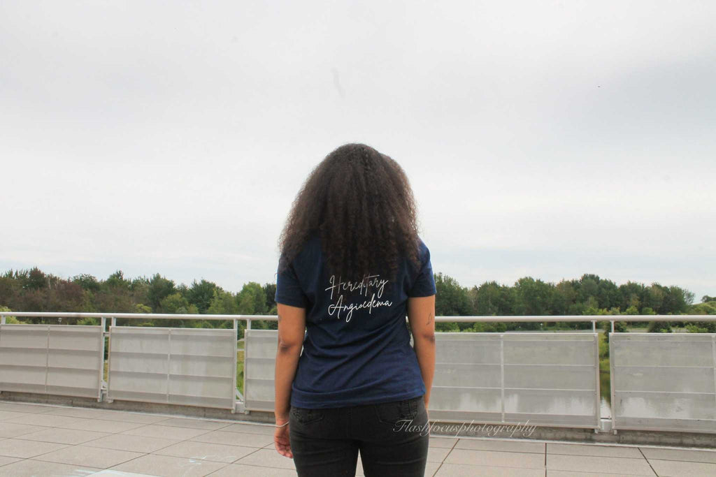 Face Off T-Shirt with light blue and floral design showcasing bold message and soft fabric