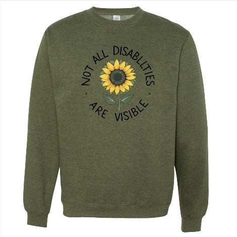 Olive green crewneck sweatshirt with sunflower and "Not all disabilities are visible" message promoting invisible disability awareness